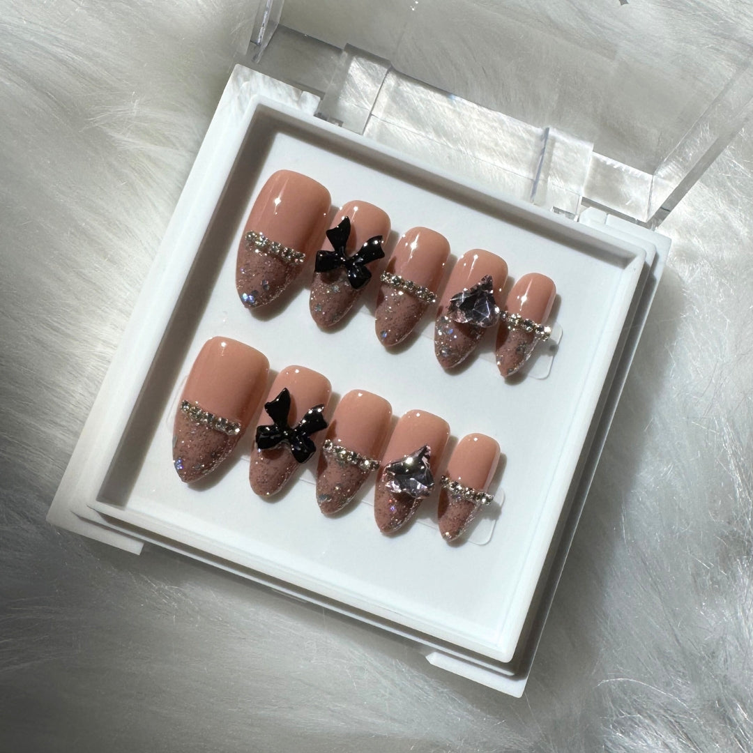 Midnight Bows - Deep Nude Press-On Nails with Glitter Tips, Black Bows
Includes 30 piece press-on nails